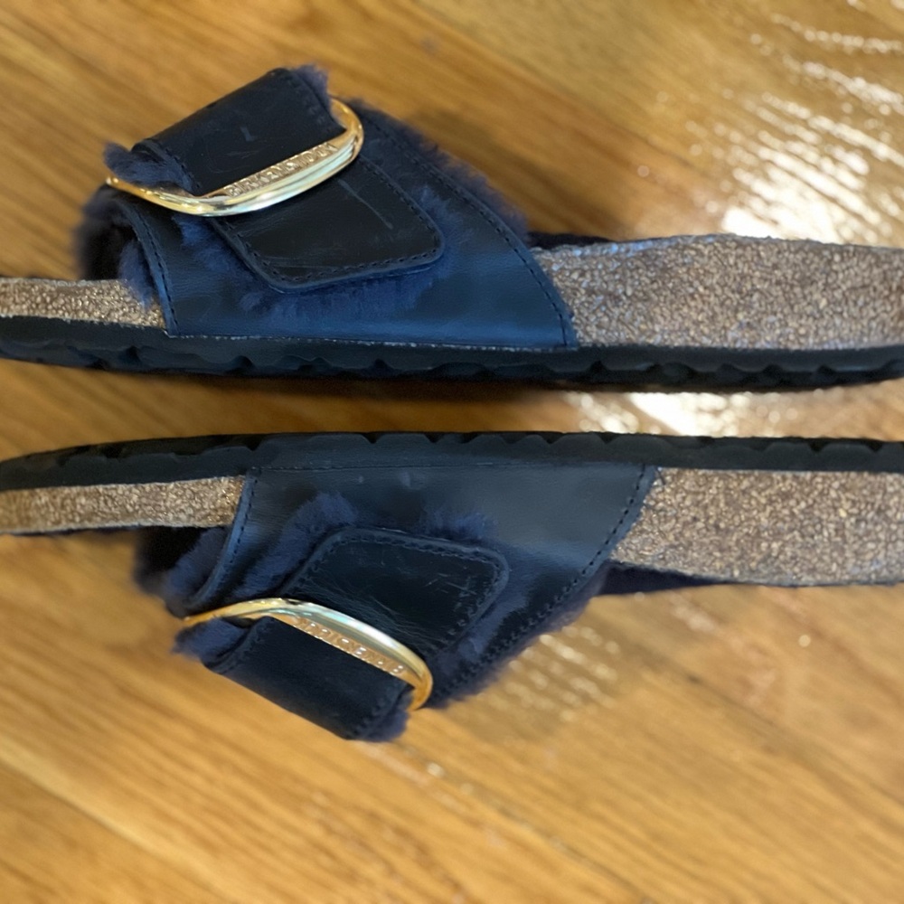 Shearling lined Birkenstock Madrid with big gold buckle in blue.